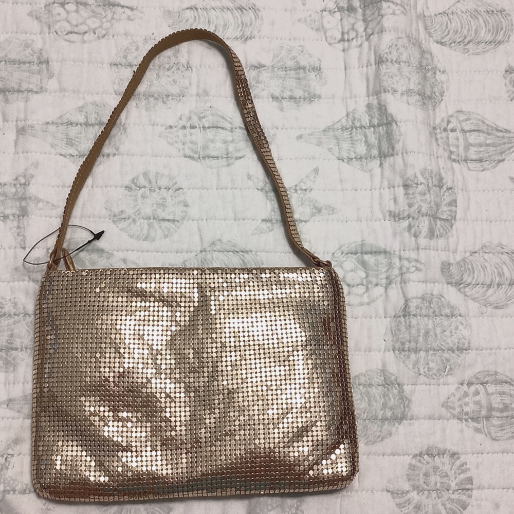 Espirit De Corp. brand gold shimmering bag.